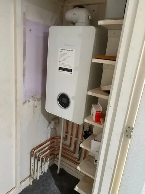 Local technician explaining air conditioning features in Telford
