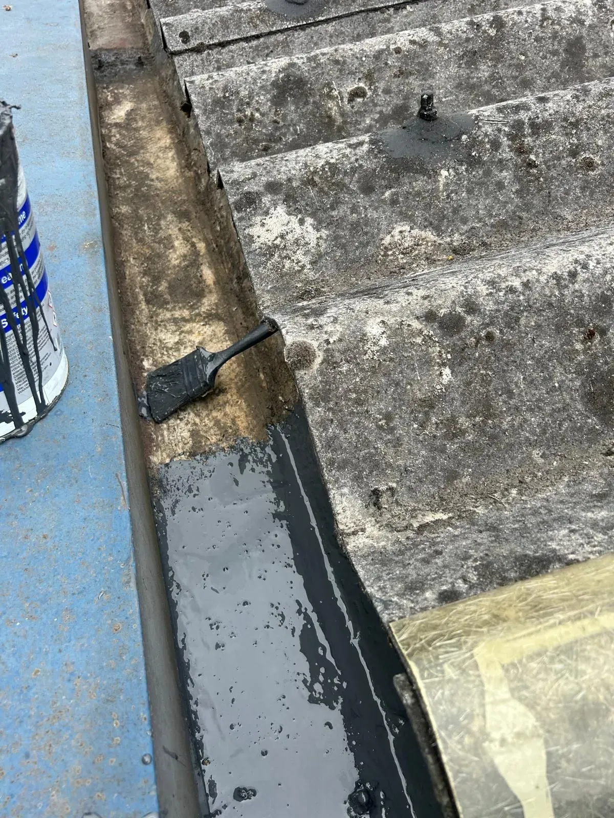 industrial gutter clean and asbestos sealer applied for longer lifespan