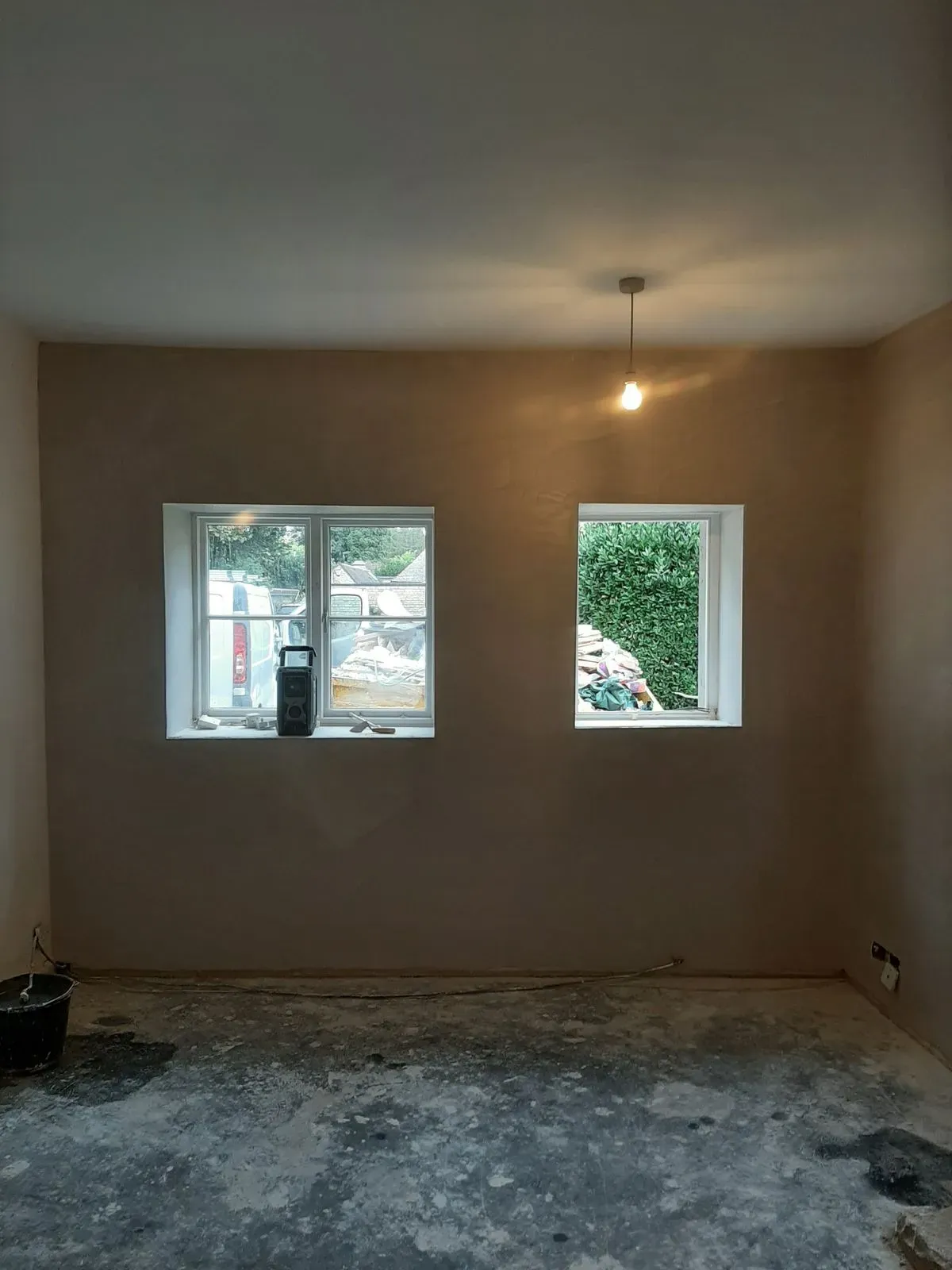 Inspecting damp walls in a Long Bennington property