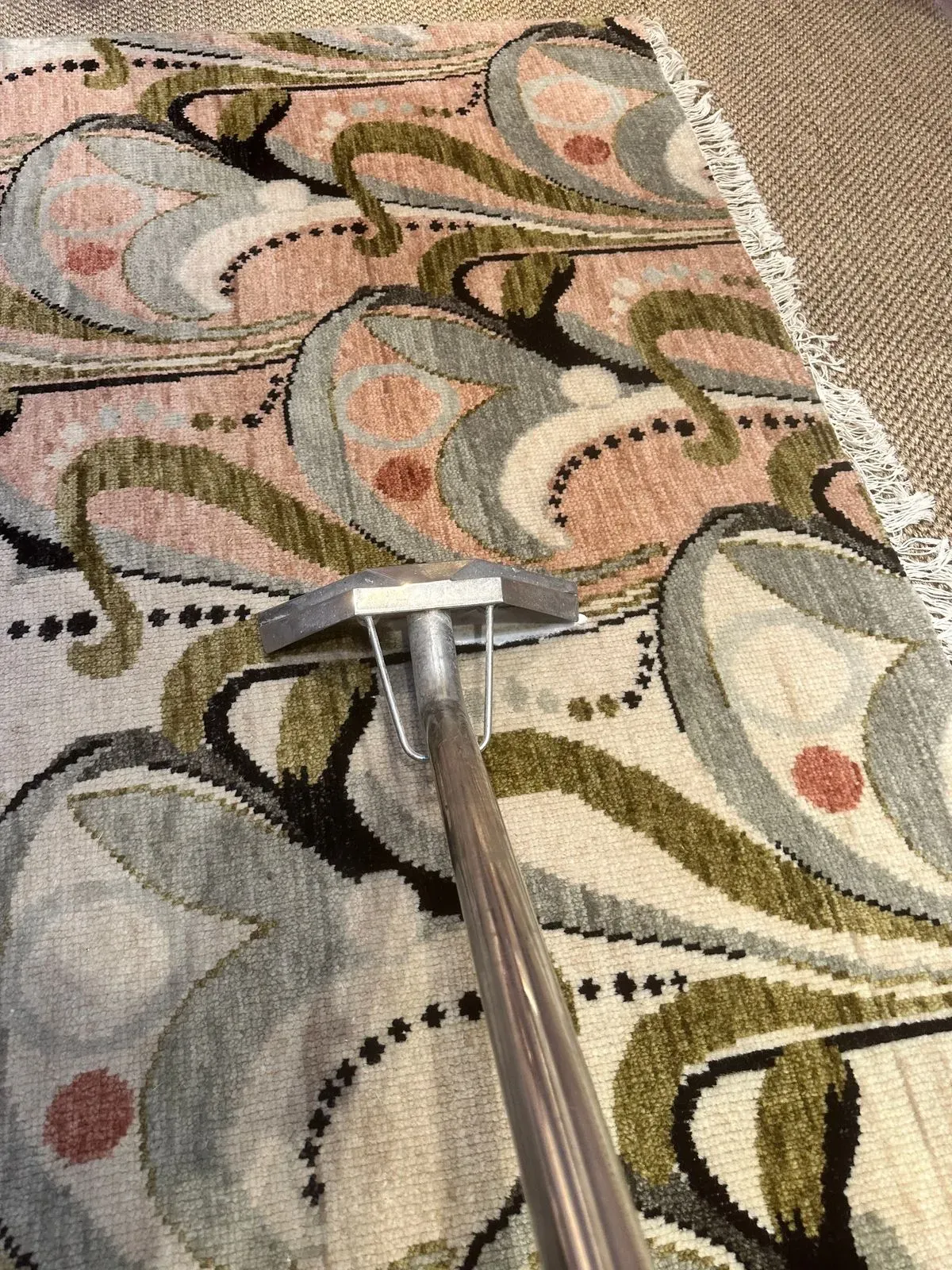 Satisfied customer admiring cleaned carpets in Mayfair
