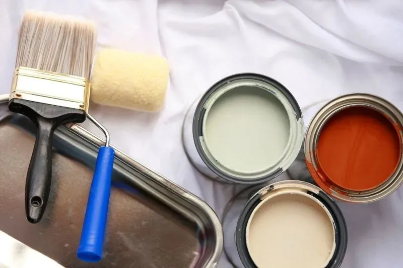 Skilled painter applying vibrant colour in a Stanmore home