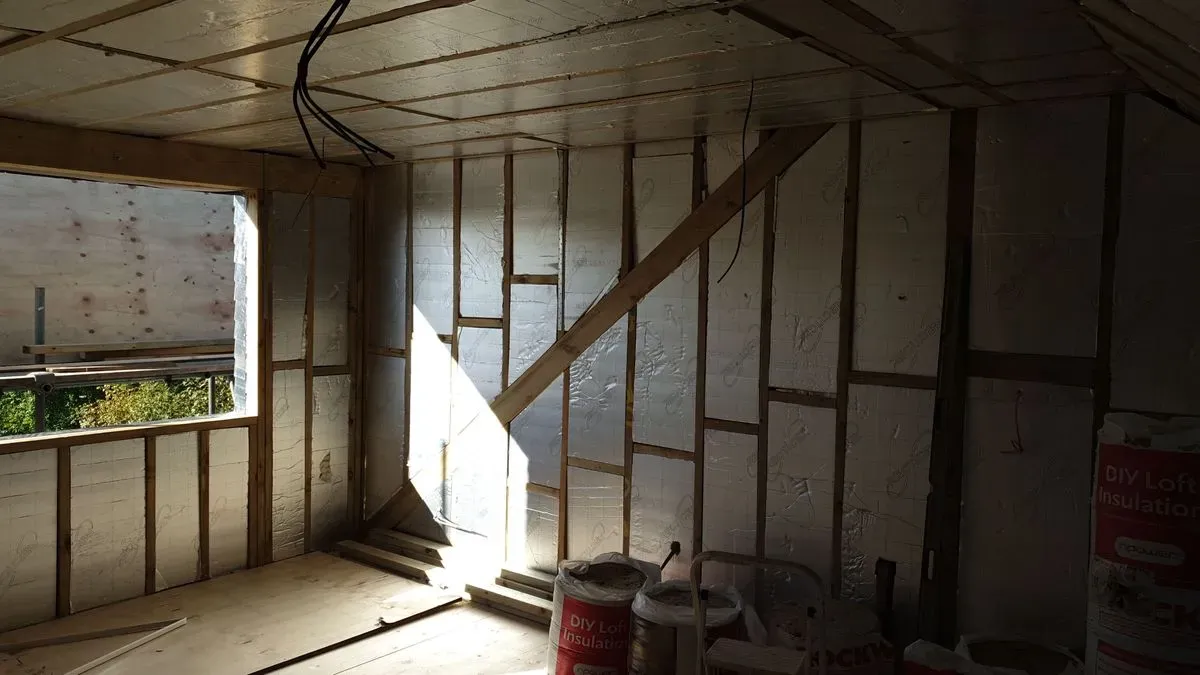 Carpenter measuring spaces in Harrow home