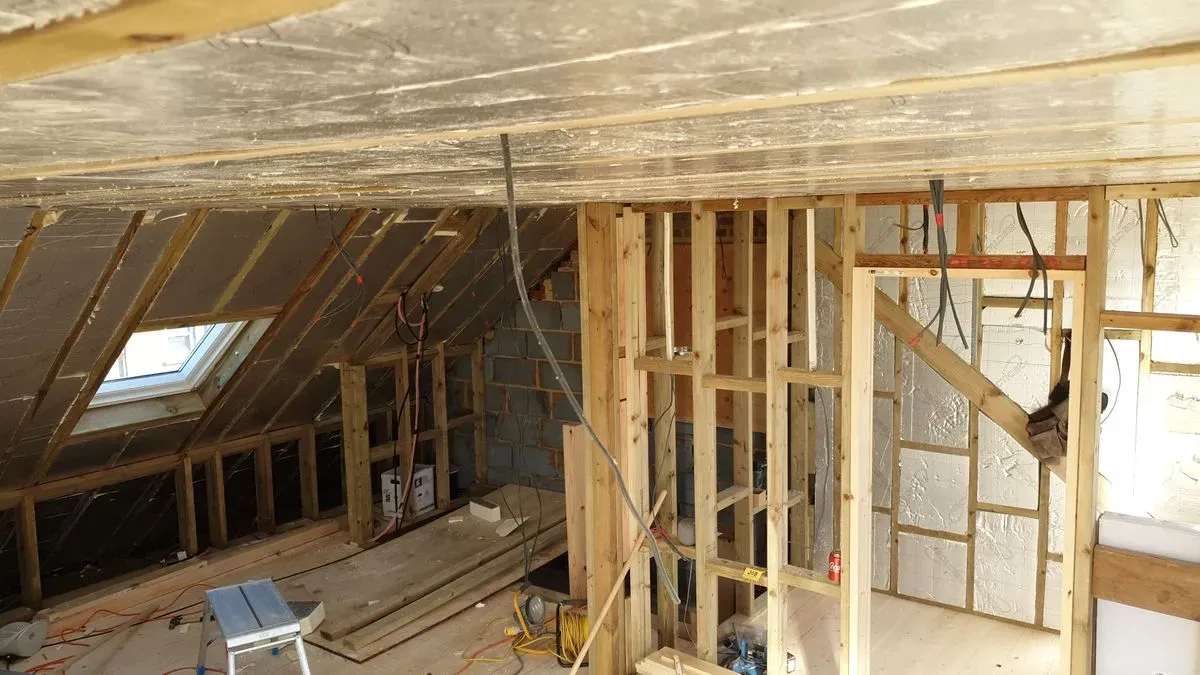 Harrow carpenter inspecting finished work