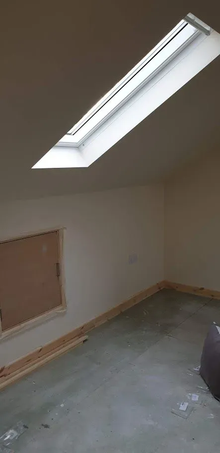 Bathroom installer examining plumbing in Harefield home