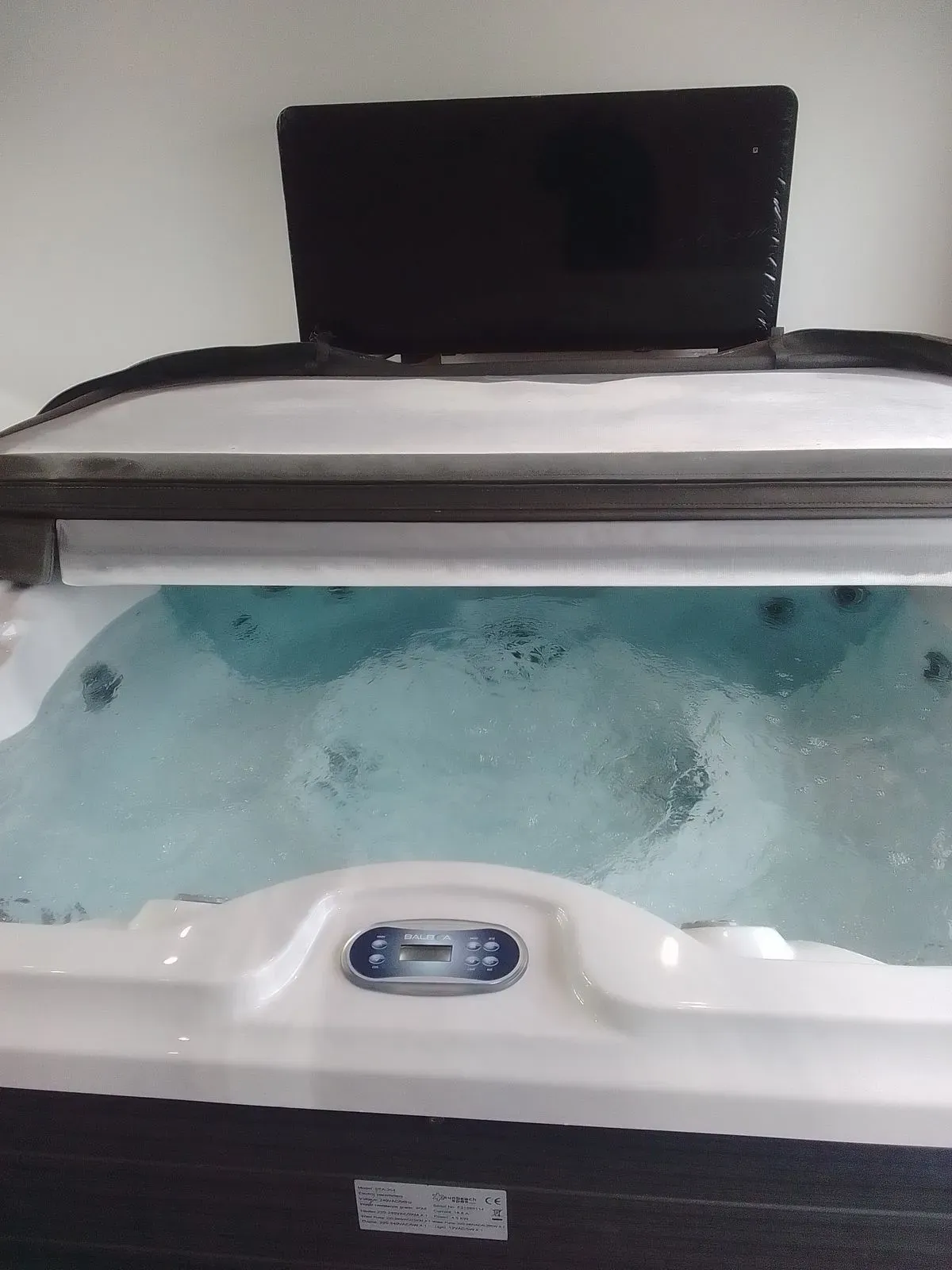 Inspecting hot tub components during servicing in Redditch