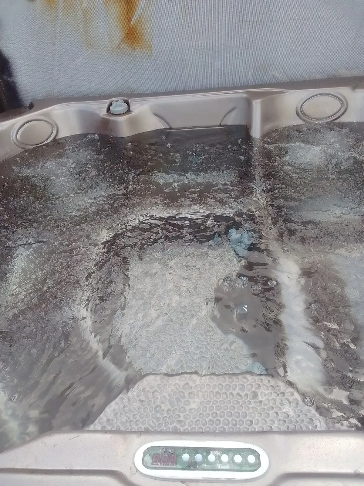 Cleaning process in action for a hot tub in Redditch garden
