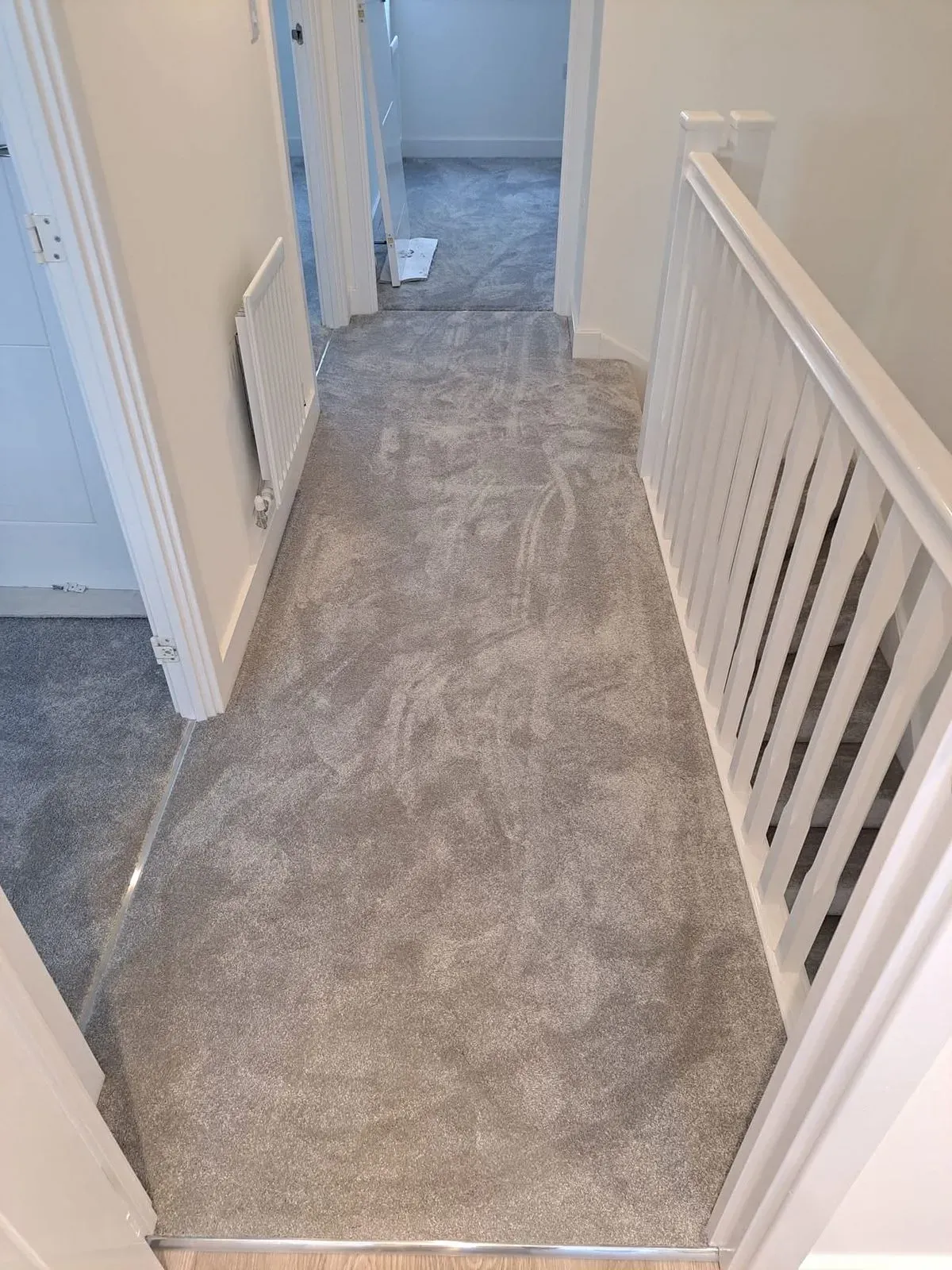 Professional carpet fitting team installing carpet in Fareham home