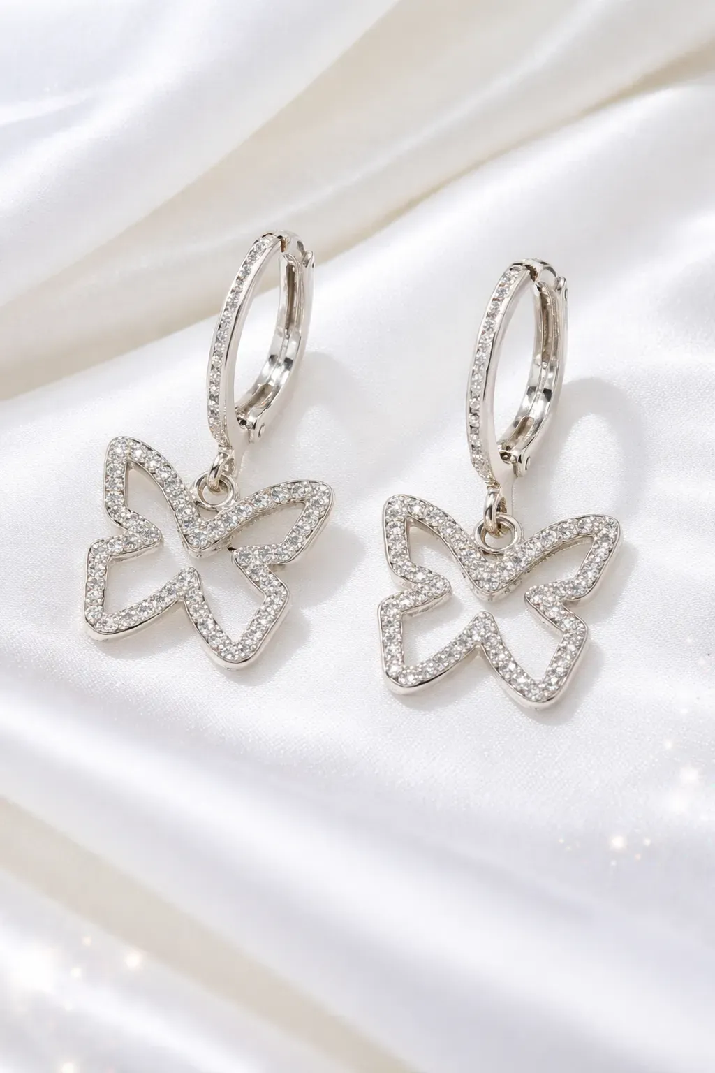 8223995766590-epqjiskjxydgiixwfkci6p-Elegant-butterfly-hoop-earrings-close-up thumbnail image