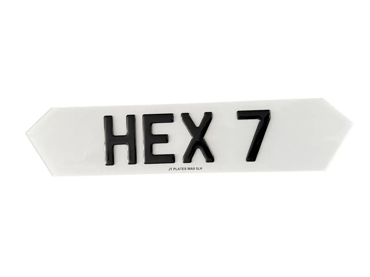 Close-up of 4D number plates showcasing embossed letters