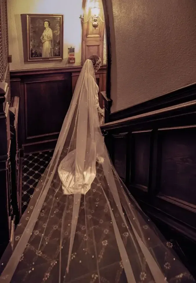     Bride with trailing veil captured by Eastbourne wedding photographer
