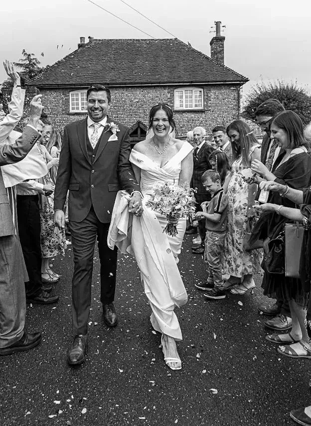 Bride and groom confetti walk at Selden Barns