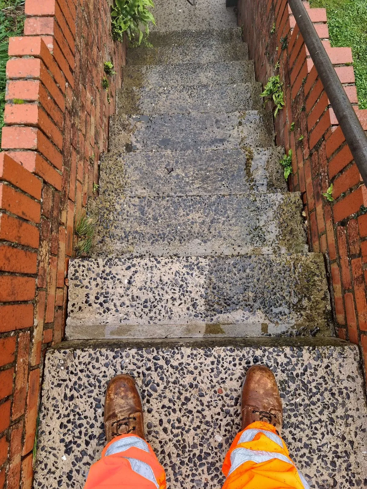 Pressure washing steps to an elderly persons home