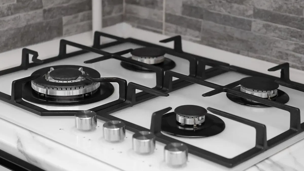 Local repair team assessing range cooker issues