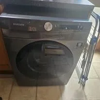 Close-up of tumble dryer connections being set up