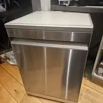 Satisfied customer observing tumble dryer installation