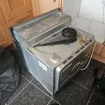 Customer receiving washing machine repair service in Southend