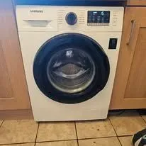 Expert technician diagnosing a washing machine issue
