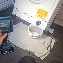 Dishwasher Repairs in Brentwood technician examining appliance