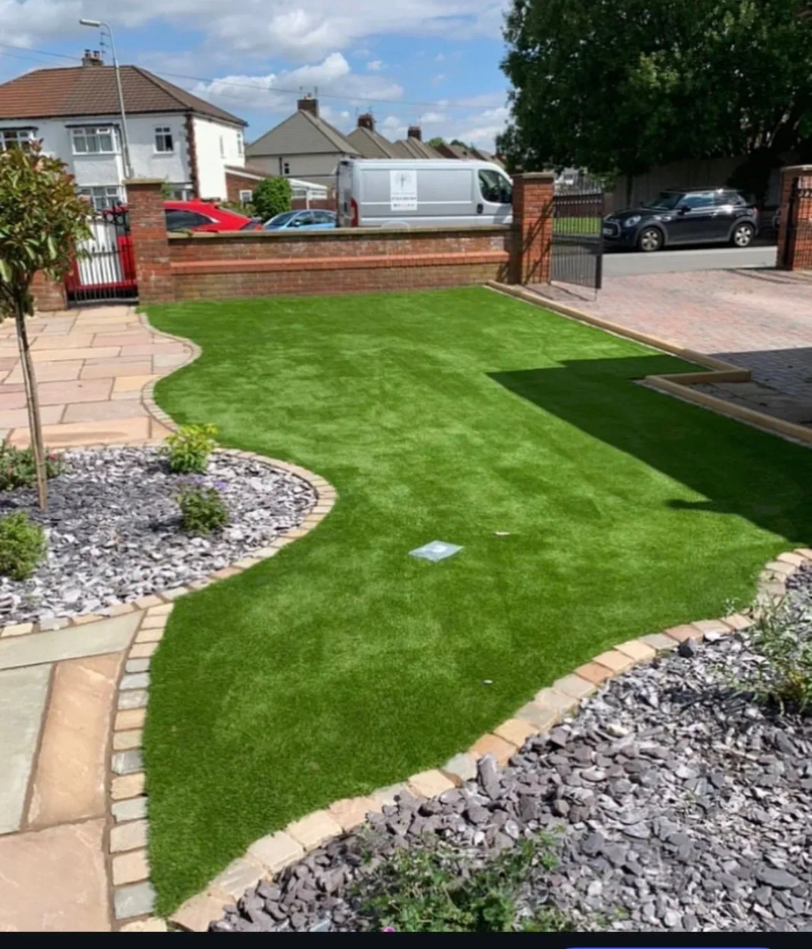 Children playing on artificial grass in Croxteth Park