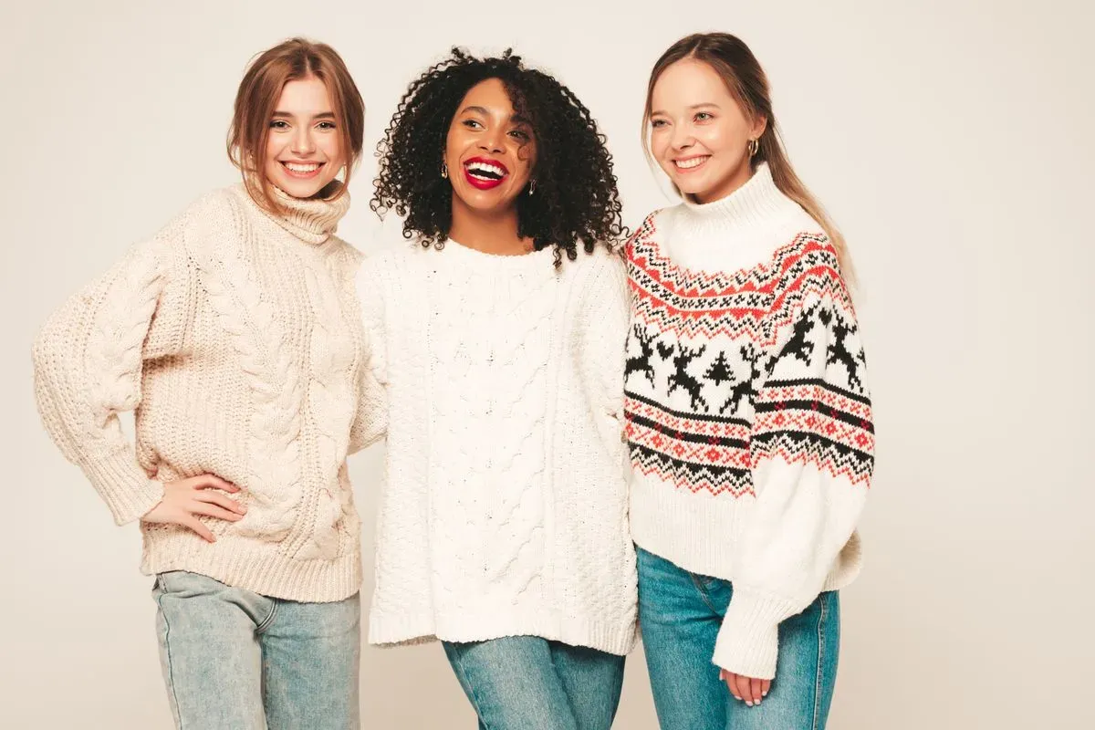 three-young-beautiful-smiling-hipster-girls-trendy-winter-sweaters-positive-models-having-fun-hugging collection background image