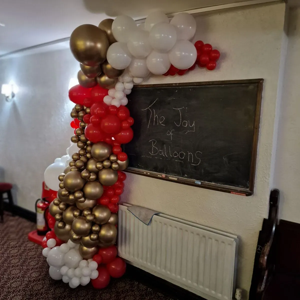 Festive balloon arch enhancing a birthday party in Brewood
