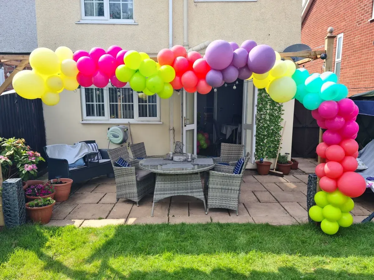 Professional team assembling balloon arch in Brewood