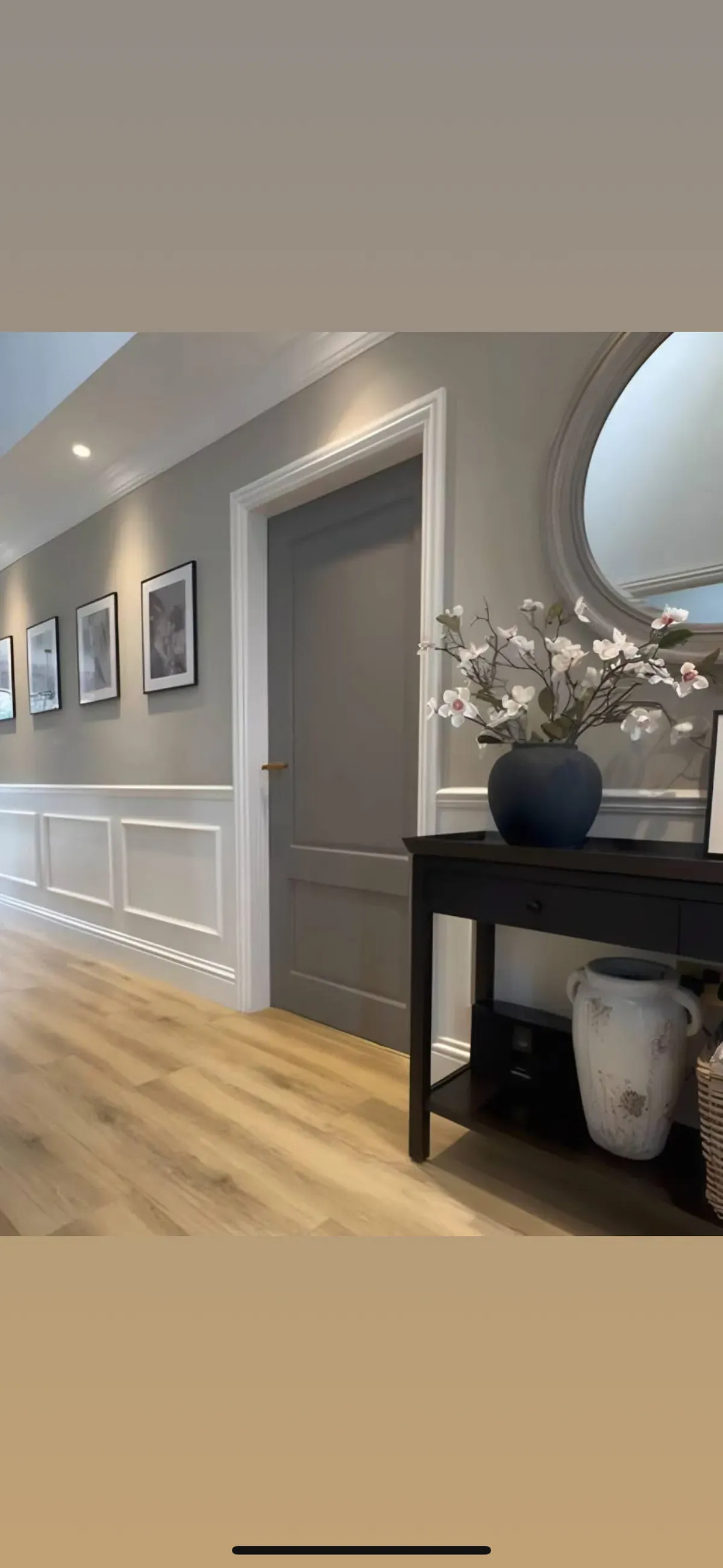 Fully decorated and new flooring laid finished off by picture and mirror hanging Descriptive text for the image