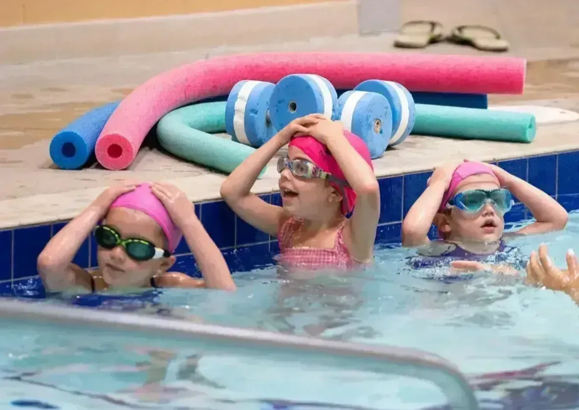 adult swimmers practicing strokes in a new romley pool