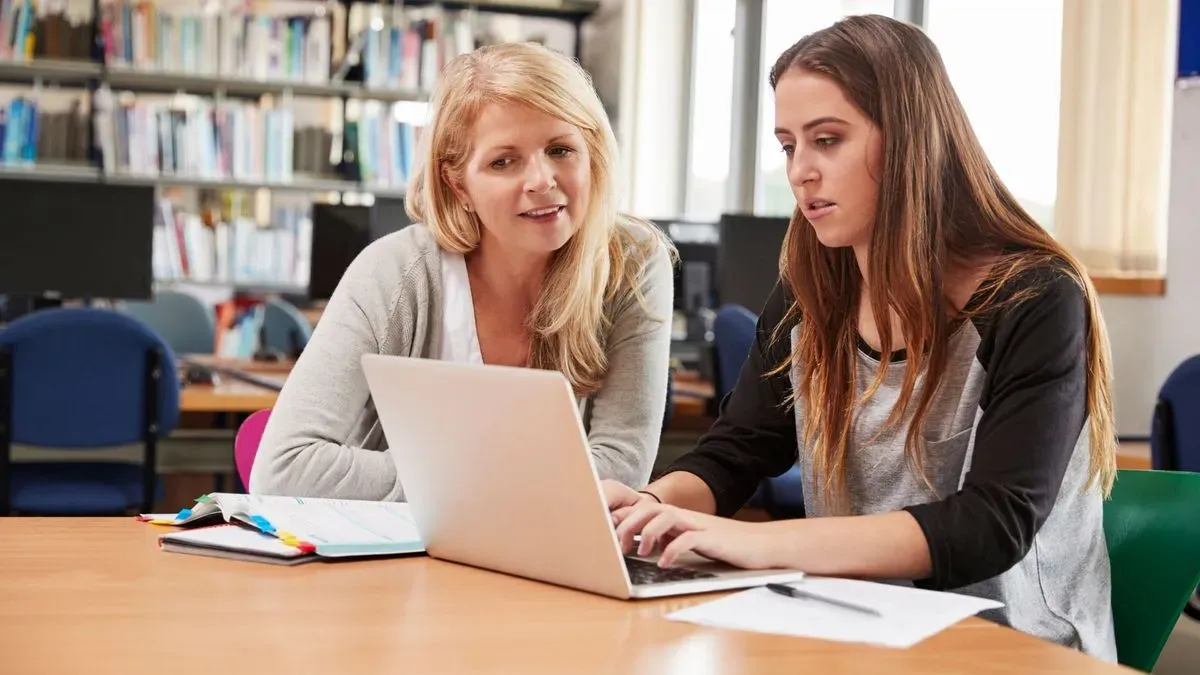 Maths tutor in New Malden helping a student with homework