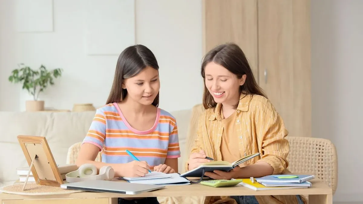 Motivated student studying with a maths tutor in New Malden