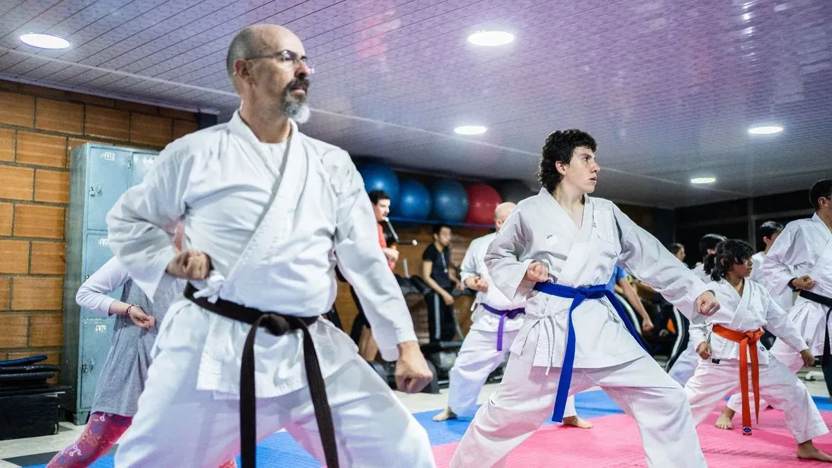 Instructor guiding students in Stanwell karate class