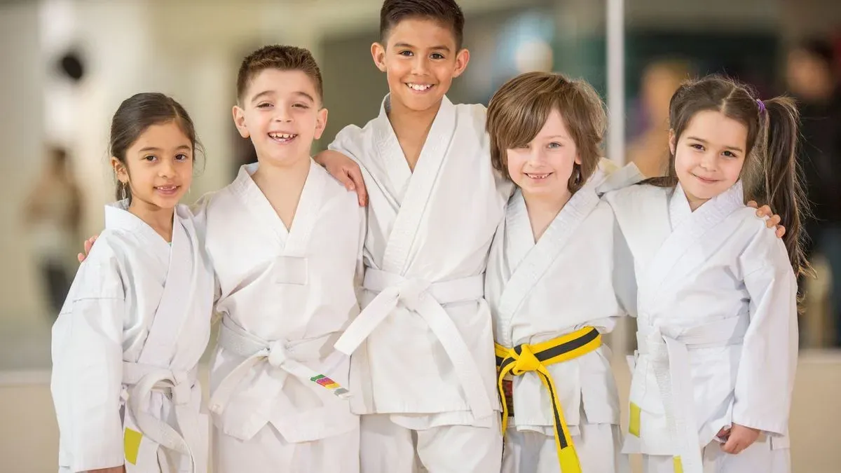 Happy children participating in karate lessons in Stanwell