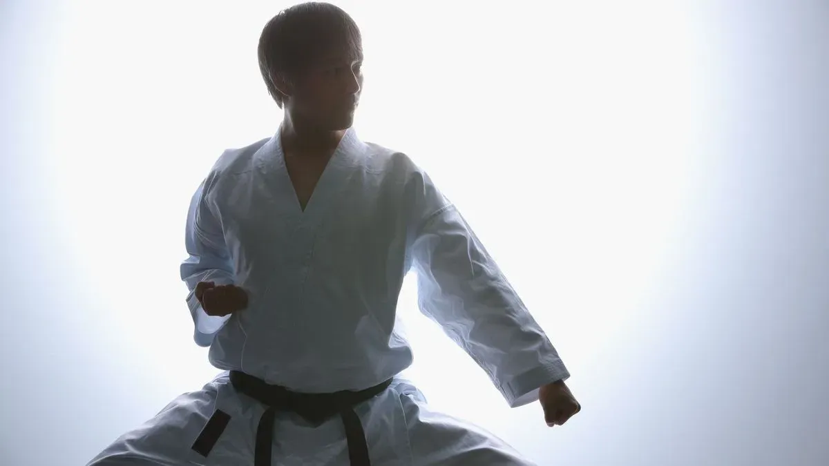 Two adults sparring in beginner-friendly karate class in Stanwell