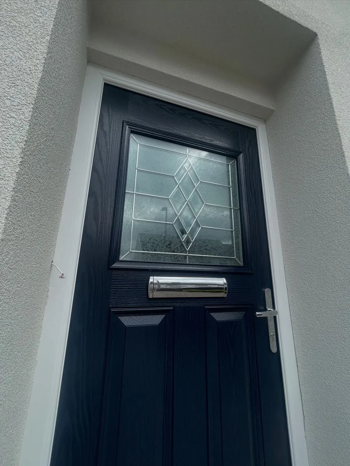 Close-up of a modern front door installed in Fordham