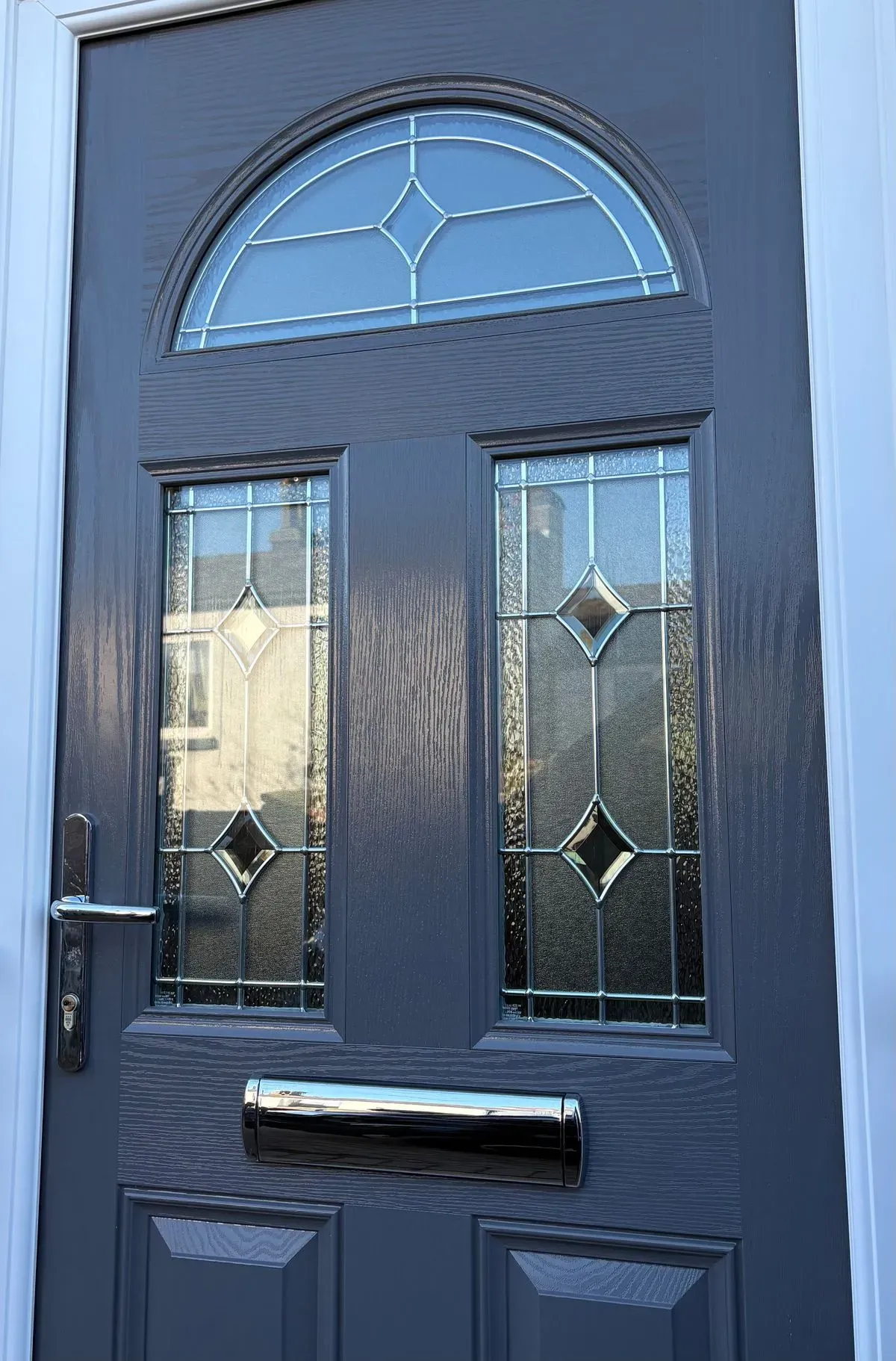 Expert team installing a stylish front door in Fordham
