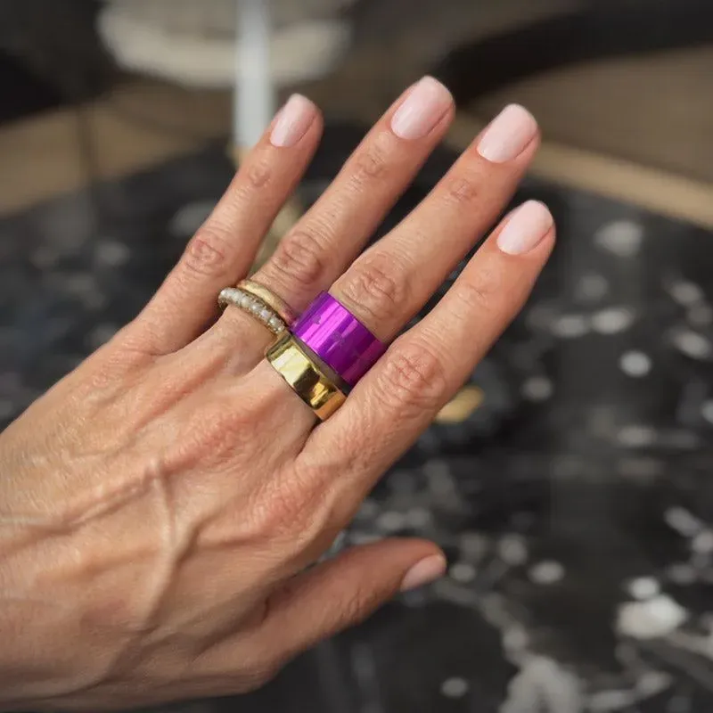 womans-hand-purple-gold-ring thumbnail image