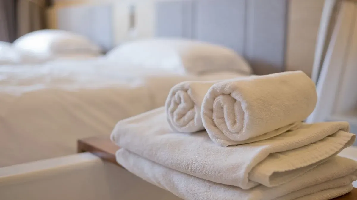 Bed making and linen changing image background image