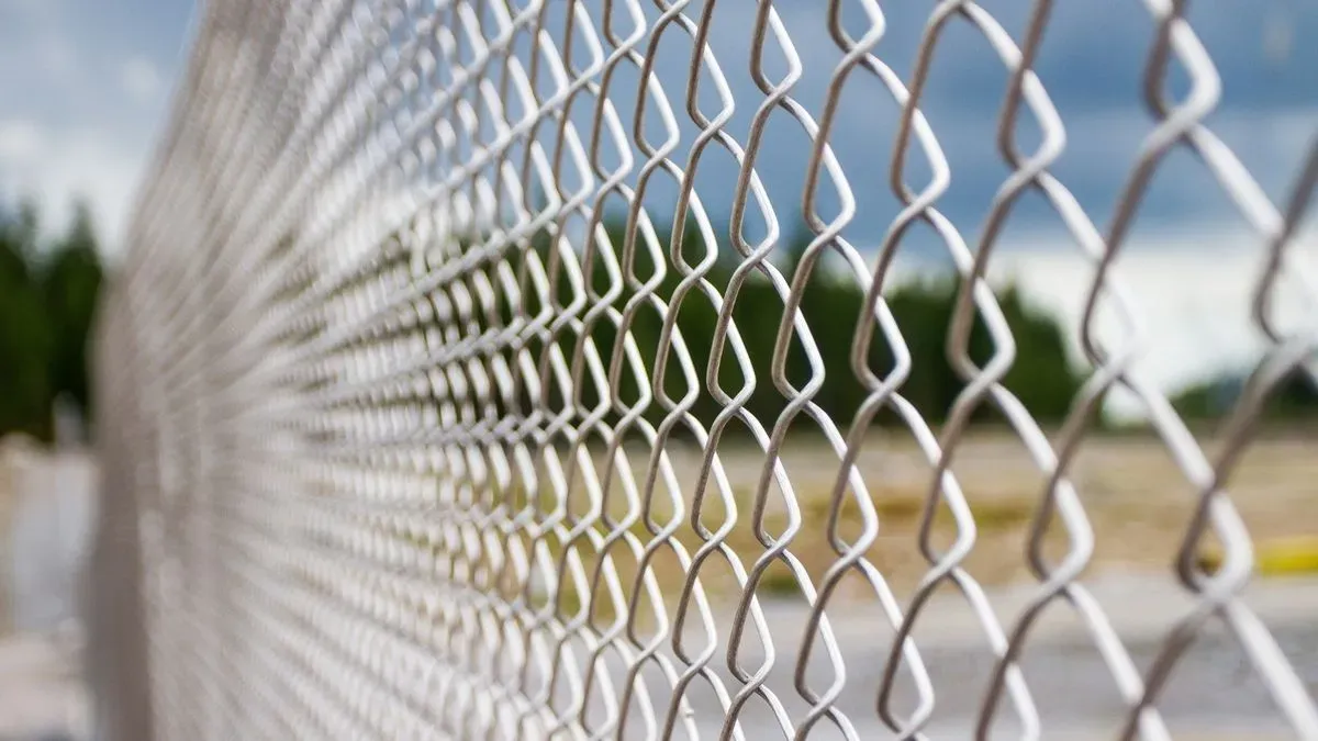 Chain-link fence installation image background image