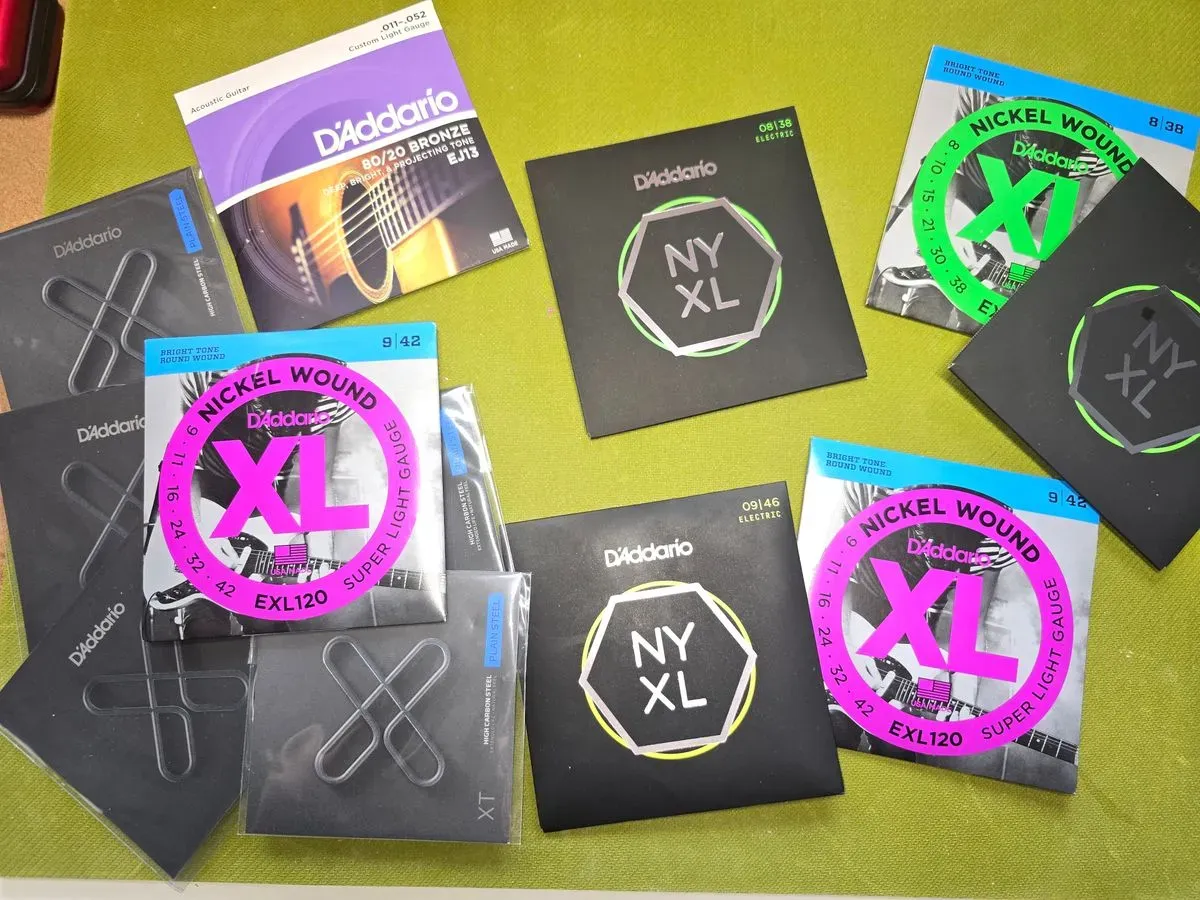 Supply and fit guitar strings, restringing service