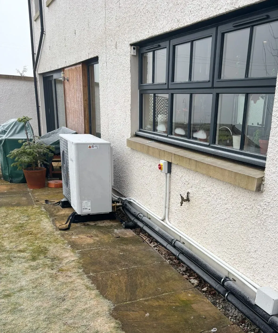 Before and after heat pump installation in Wishaw