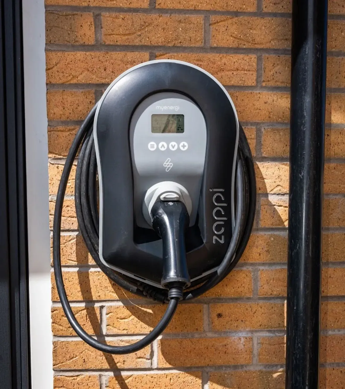 Customer consulting with electricians about energy-efficient solutions in Hamilton