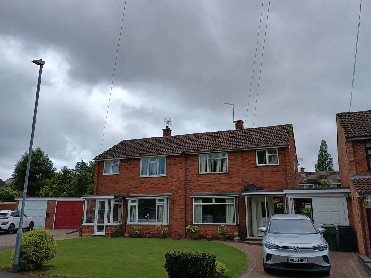 Before and after of a roof cleaning in Redditch