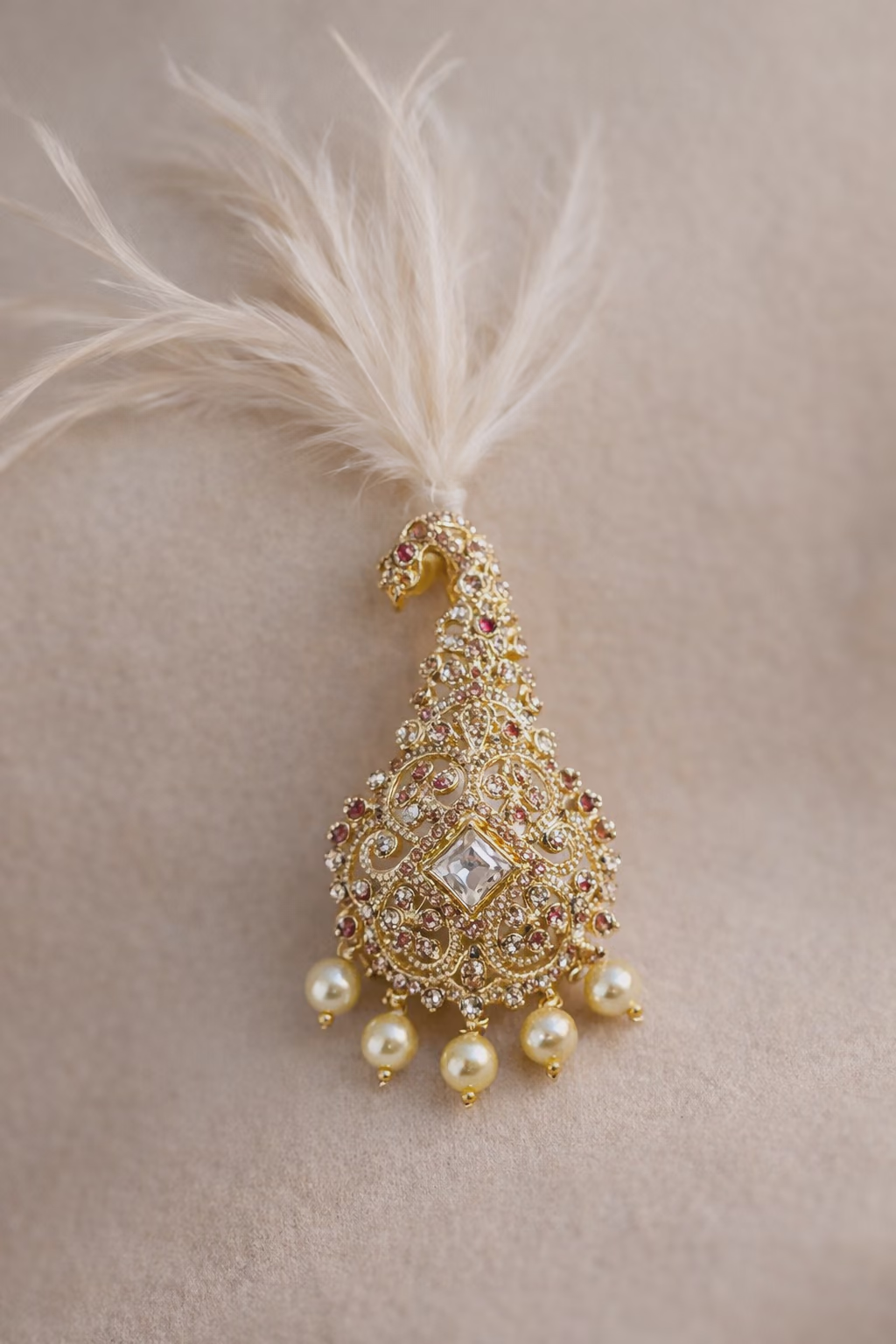 Ornate Gold Brooch with Feather and Pearl Embellishments