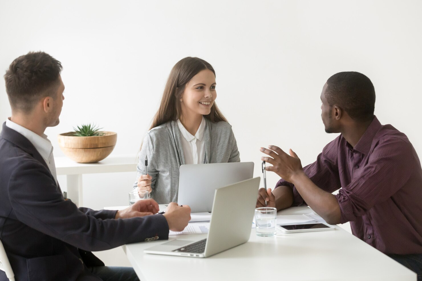 Three people having a conversation