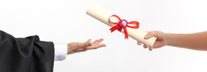One person handing a rolled up, sealed document to another