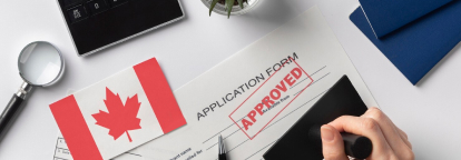 Documents with canadian flag and stamp with text APPROVED
