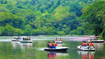 Pookode Lake in Wayanad surrounded by evergreen forest hills