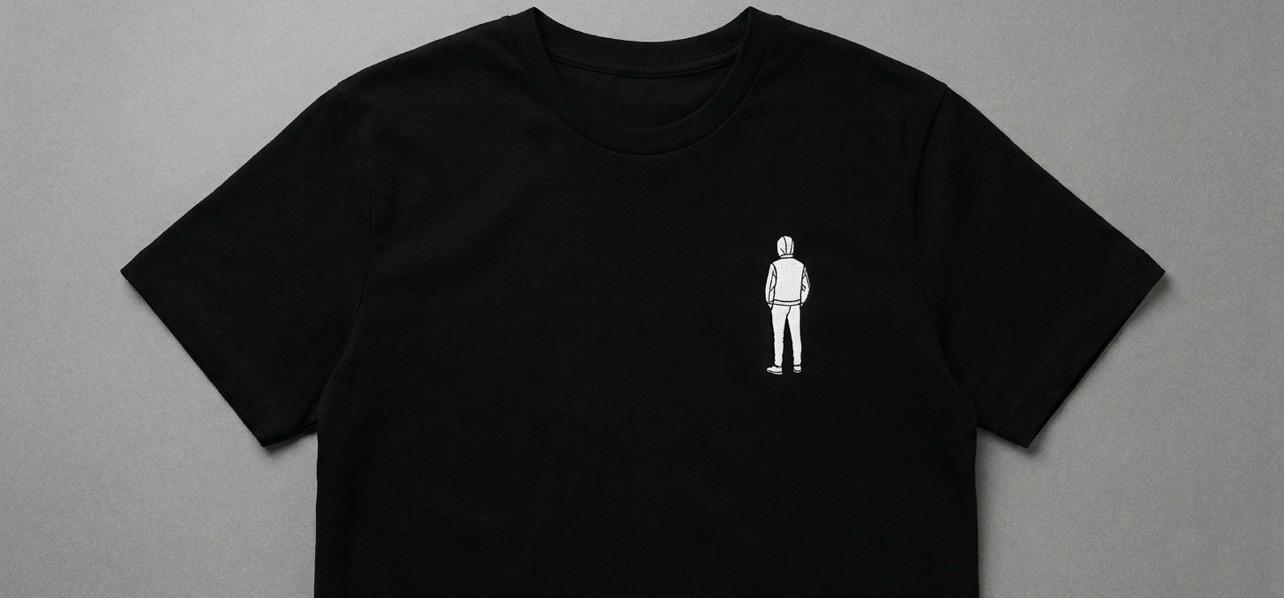 Black oversized T-shirt with a white logo on the top left - Image 1