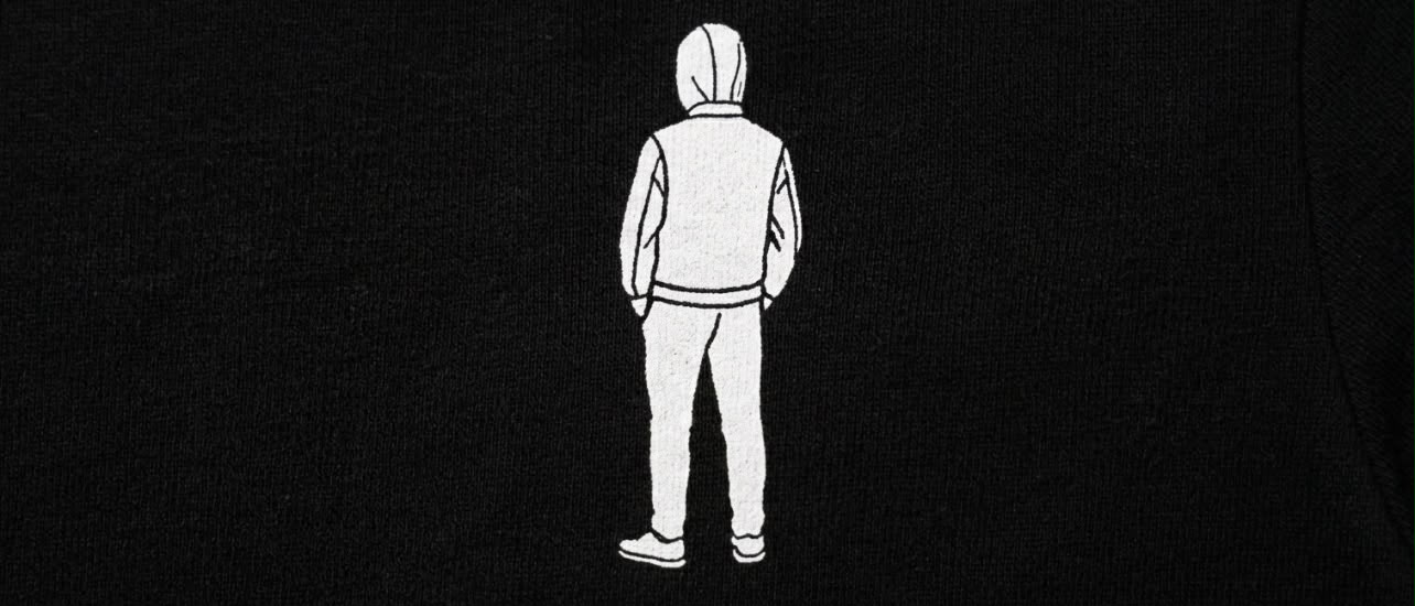 Black oversized T-shirt with a white logo on the top left 3