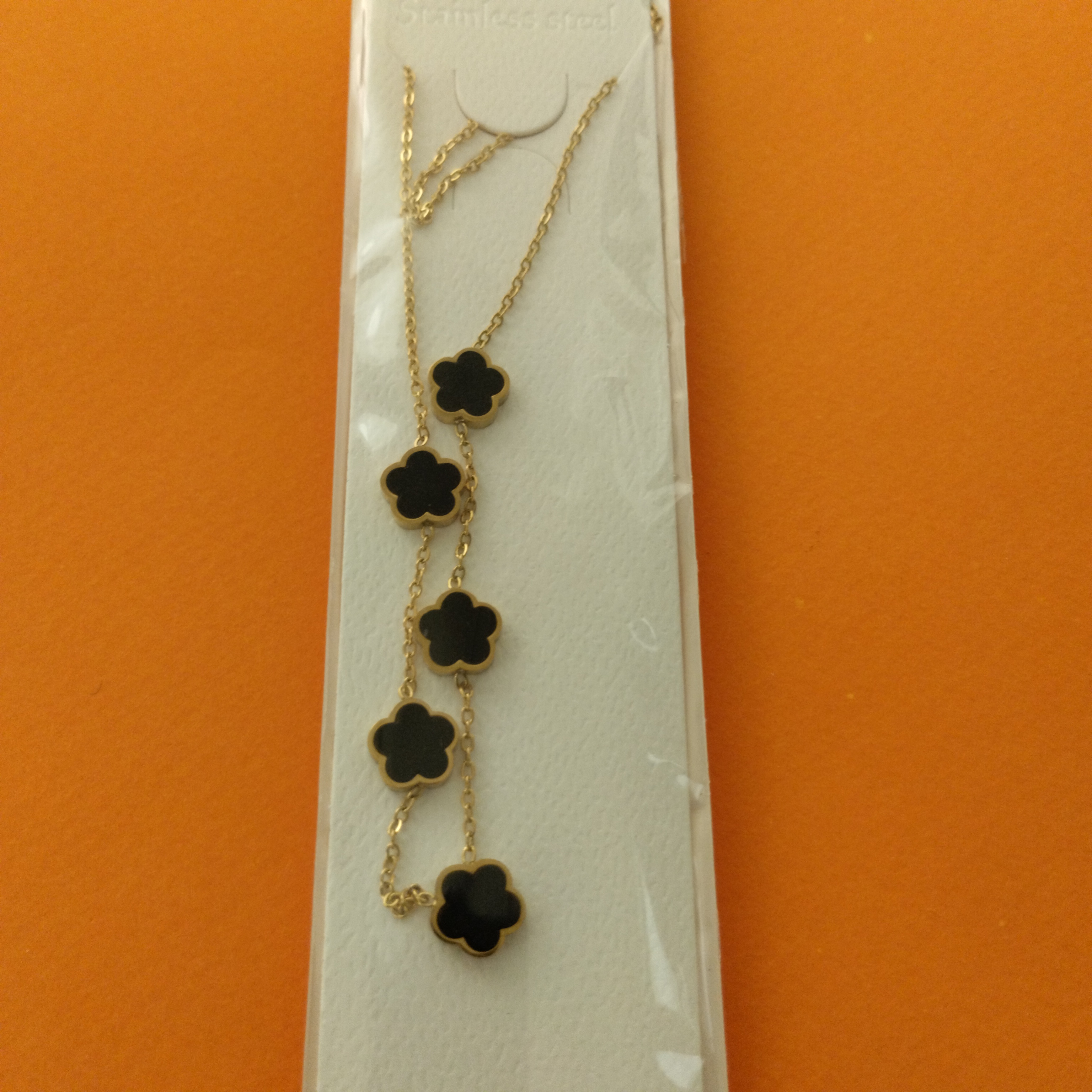 Collier trèfle noir doré